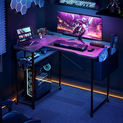 Small Gaming Desk with Power Outlets, 40 Inch L Shaped Desks with Reversible Shelves and Storage Bag,Computer Desk Corner Desk PC Desk for Gaming and Home Office Table,Black Carbon